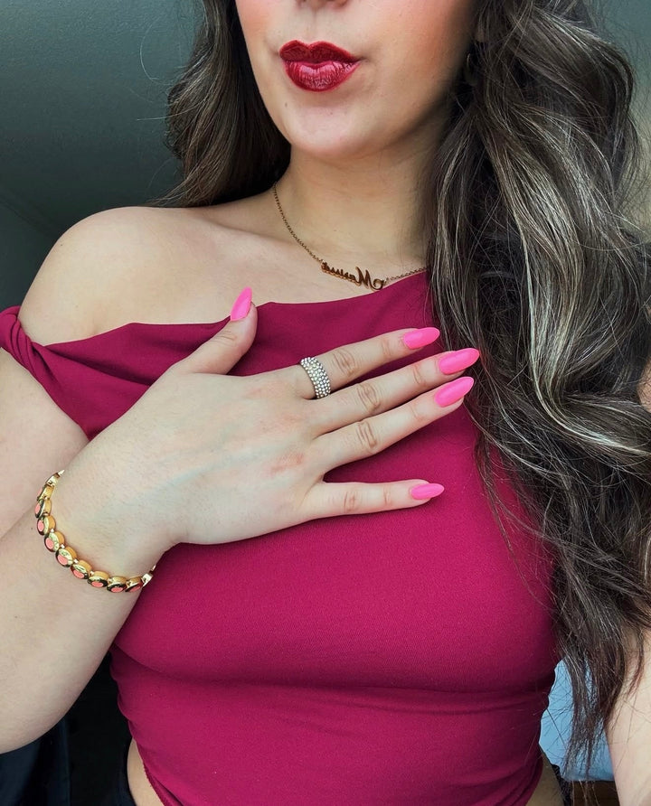 AV Jewels Cocktail Club Girl Marissa in her valentines day outift, styling with her AV Jewels Jewelry Pieces. She is wearing her Lemontini charm bracelet and her gold iced ave chunky stacking ring.