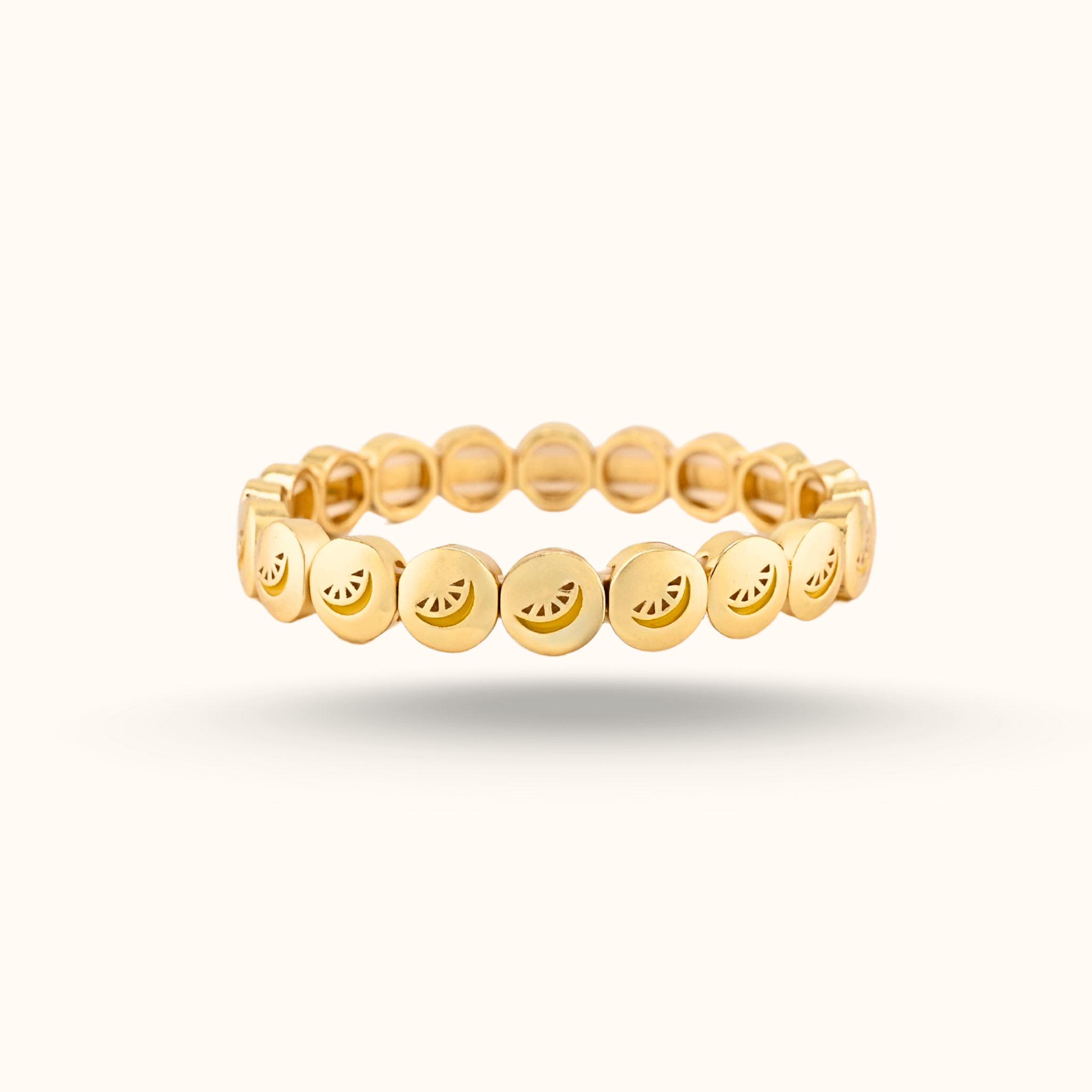 Gold bracelet with round beads with a lemon slice enamel design