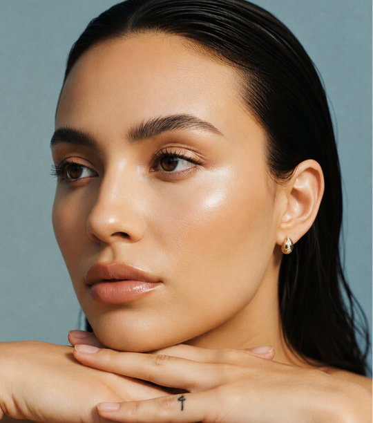 Woman with a neutral expression against a gray background wearing AV Jewels Jewelry Espresso stud earrings