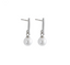 Silver earrings with white pearls on a gray background