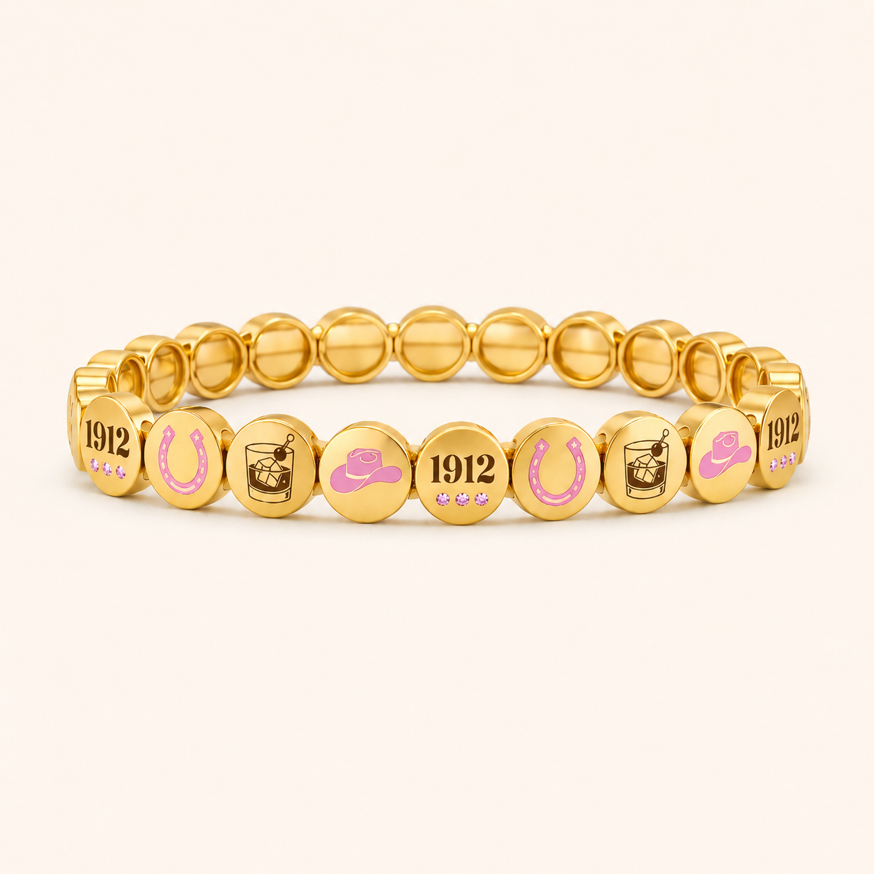 Gold bracelet with various symbols and numbers on a white background