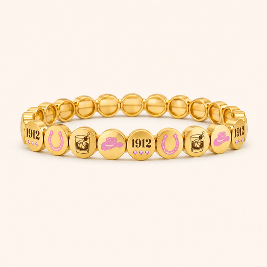 Gold bracelet with various symbols and numbers on a white background