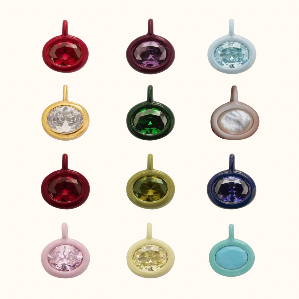 your month your moment av jewels cubic zirconia birthstone pendants. assortment of all 12 months out of the year in order on a plain background